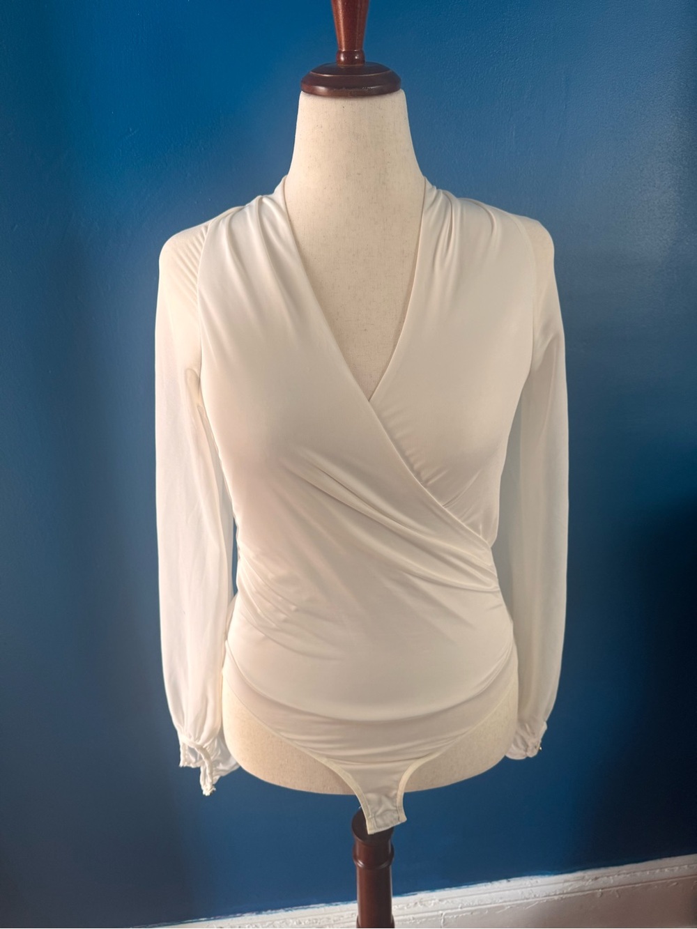 bebe Cream Drape-Front Long Sleeve Bodysuit, size S